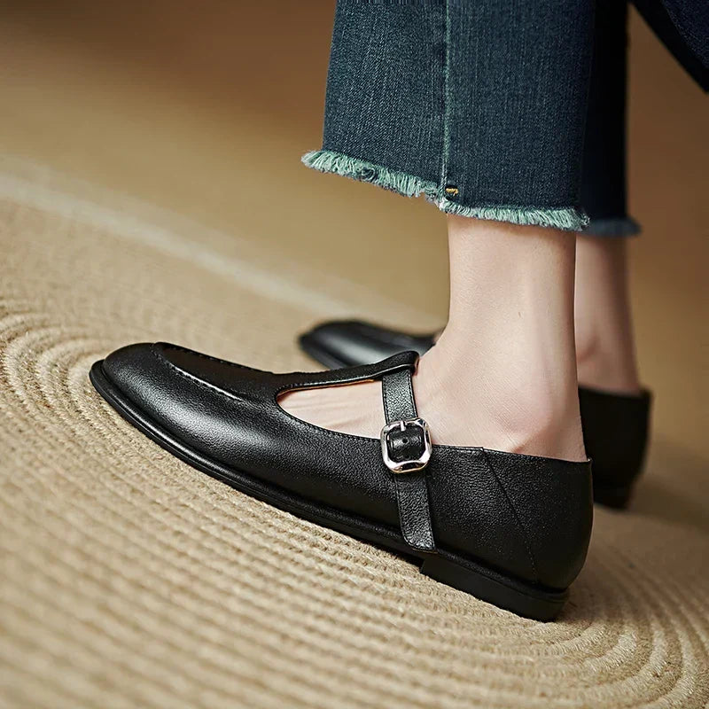 Black Selvana low-heeled pumps by THE WHITMORE FAMILY with a sleek design and comfortable low heel.