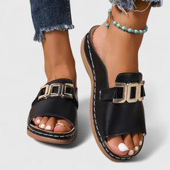Black Sharpay™ sophisticated sandals by THE WHITMORE FAMILY with elegant straps and a sleek design.