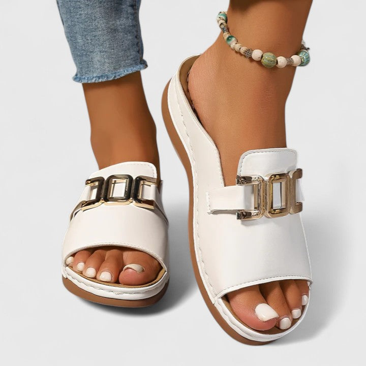 Black Sharpay™ sophisticated sandals by THE WHITMORE FAMILY with elegant straps and stylish design, perfect for formal occasions.
