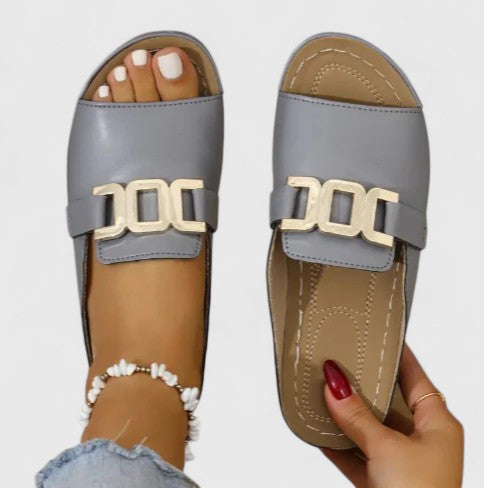 Black Sharpay™ sophisticated sandals by THE WHITMORE FAMILY with elegant straps and a stylish, modern design.