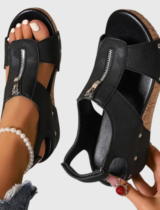Black Styla™ orthopedic sandals by THE WHITMORE FAMILY featuring supportive straps and cushioned soles.