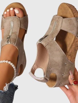 Black Styla™ orthopedic sandals by THE WHITMORE FAMILY, featuring supportive design and cushioned soles for comfortable wear.