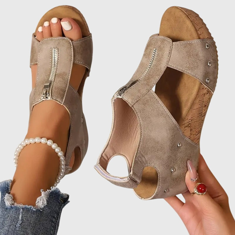 Black Styla™ orthopedic sandals by THE WHITMORE FAMILY, featuring supportive design and cushioned soles for comfortable wear.