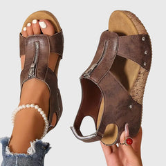 Black Styla™ orthopedic sandals by THE WHITMORE FAMILY, featuring supportive design and comfortable straps.