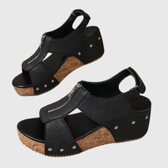 Black Styla™ orthopedic sandals by THE WHITMORE FAMILY with supportive straps and cushioned insoles for comfortable wear.
