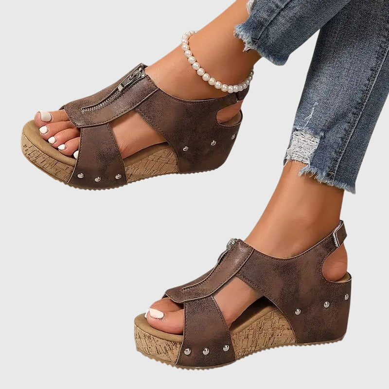 Black Styla™ orthopedic sandals by THE WHITMORE FAMILY, featuring supportive footbed and adjustable straps for comfort.