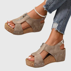 Black Styla™ orthopedic sandals by THE WHITMORE FAMILY with cushioned soles and adjustable straps for comfortable support.