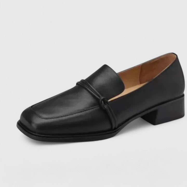 Black Dixie orthopedic loafers by THE WHITMORE FAMILY, featuring comfortable design and classic slip-on style.