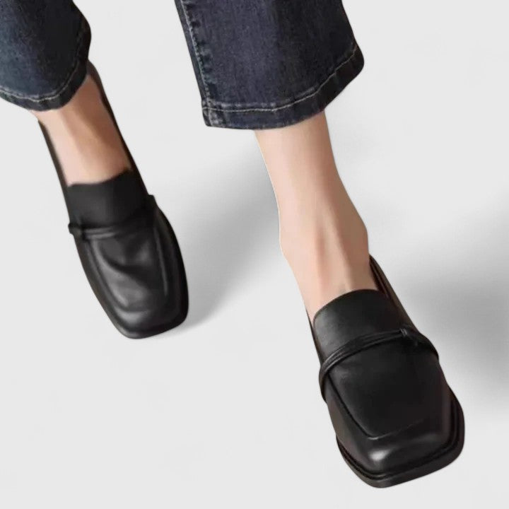Black Dixie orthopedic loafers by THE WHITMORE FAMILY, featuring comfortable design and classic slip-on style for everyday wear.