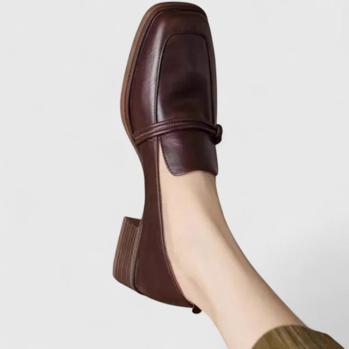 Black Dixie orthopedic loafers by THE WHITMORE FAMILY, showing a stylish, comfortable shoe design with slip-on style and supportive sole.
