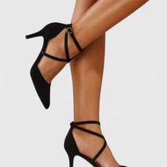 Black Veylah elegant heels by THE WHITMORE FAMILY with pointed toes and sleek design, perfect for formal occasions.