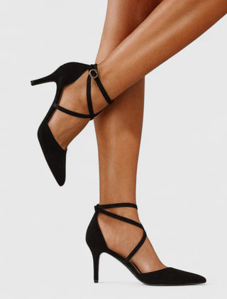 Black Veylah elegant heels by THE WHITMORE FAMILY with pointed toes and sleek design, perfect for formal occasions.