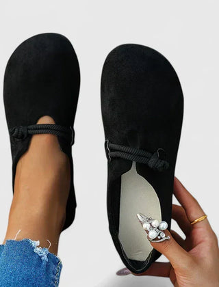 Black Ysavriann orthopedic loafers by THE WHITMORE FAMILY, featuring comfortable slip-on design and supportive insole.