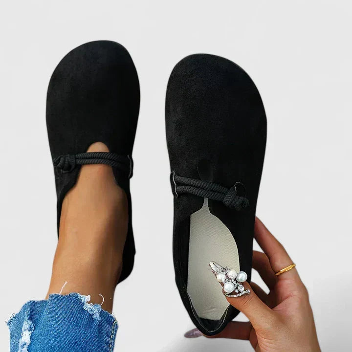 Black Ysavriann orthopedic loafers by THE WHITMORE FAMILY, featuring comfortable slip-on design and supportive insole.