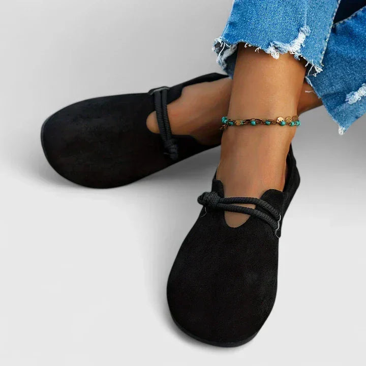 Black Ysavriann orthopedic loafers by THE WHITMORE FAMILY, featuring comfortable, supportive footwear with a sleek design.