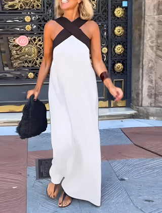 Black Delphine dress with crossed cut from THE WHITMORE FAMILY, featuring a sleek, stylish design in size XS.