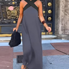 Black Delphine dress with crossed cut detail from THE WHITMORE FAMILY, shown in XS size on a model.