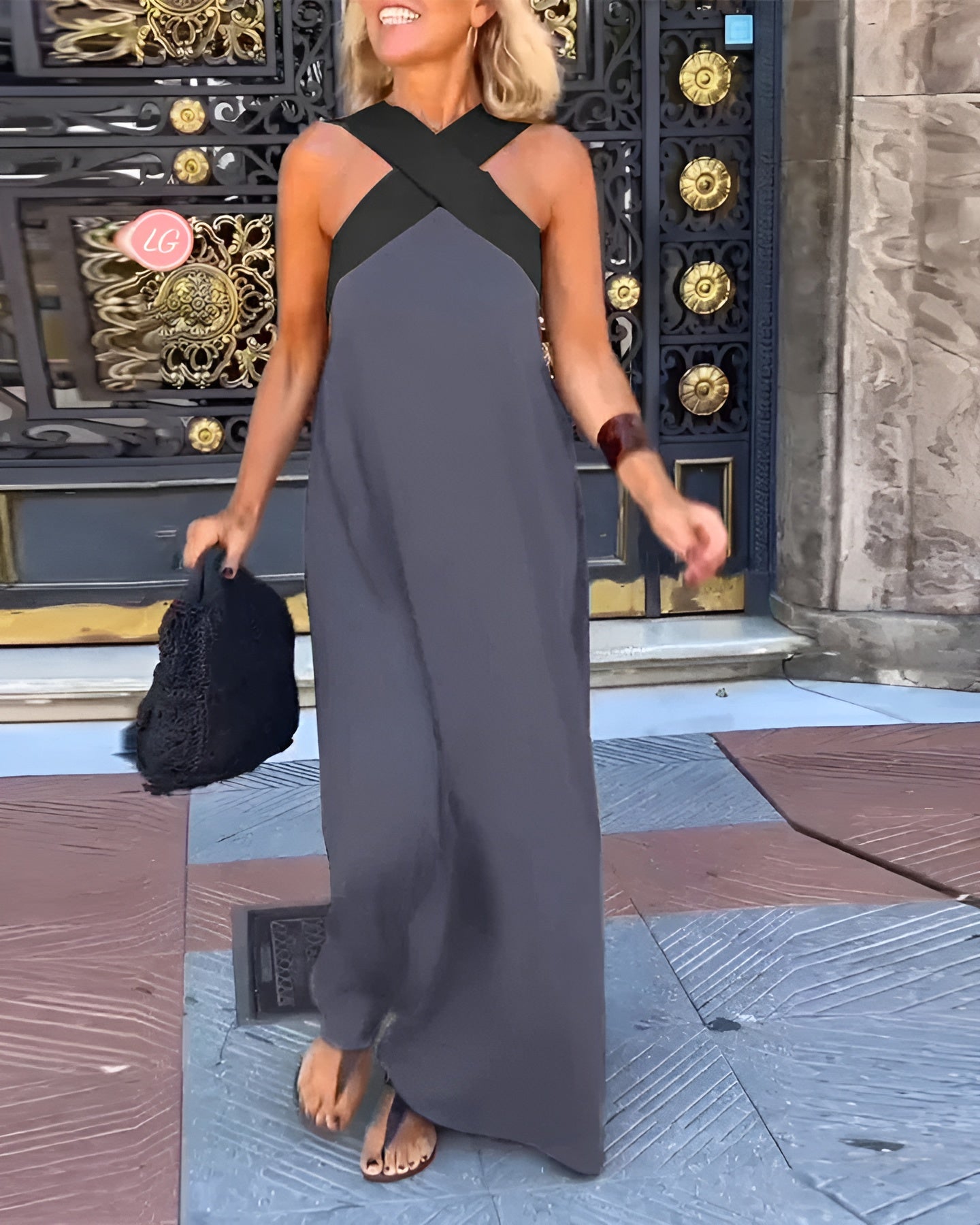 Black Delphine dress with crossed cut detail from THE WHITMORE FAMILY, shown in XS size on a model.