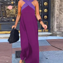 Black Delphine dress with crossed cut detail by THE WHITMORE FAMILY, shown in size XS on a model.