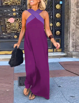 Black Delphine dress with crossed cut detail by THE WHITMORE FAMILY, shown in size XS on a model.