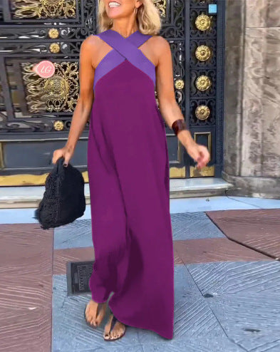 Black Delphine dress with crossed cut detail by THE WHITMORE FAMILY, shown in size XS on a model.