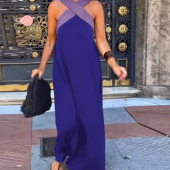 Black Delphine dress with crossed cut details by THE WHITMORE FAMILY, shown on a model. Slim fit with stylish design.