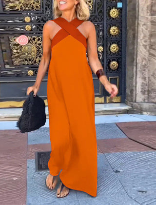 Black Delphine dress with crossed cut detail from THE WHITMORE FAMILY, shown on a model, featuring a stylish, fitted silhouette.