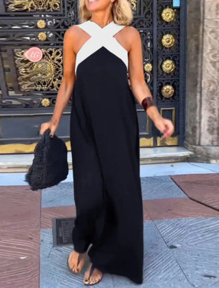 Black Delphine dress with crossed cut detail from THE WHITMORE FAMILY, shown on a model, in size XS.