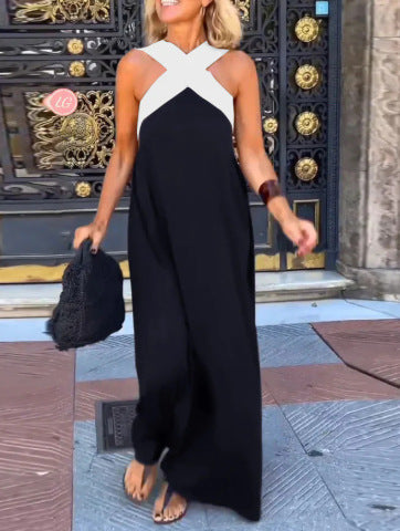 Black Delphine dress with crossed cut detail from THE WHITMORE FAMILY, shown on a model, in size XS.
