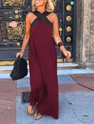 Black Delphine dress with crossed cut detail by THE WHITMORE FAMILY, shown in size XS on a model.