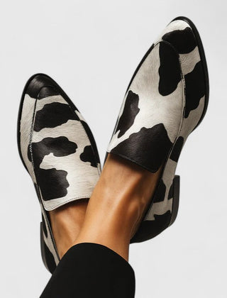 Black Quinzee Cushioned Elegance Loafers by THE WHITMORE FAMILY, showcasing sleek design and comfortable padded insoles.