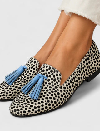 Black and white Yzabella Refined Comfort Loafers by THE WHITMORE FAMILY, showcasing stylish slip-on footwear with a sleek design.