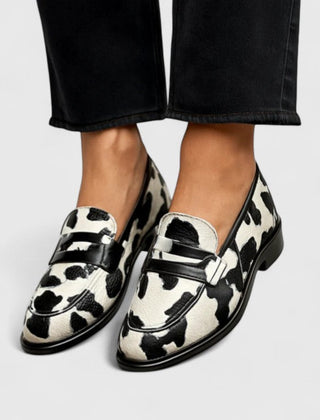 Black and white Zhaylin comfortable loafers by THE WHITMORE FAMILY, featuring a classic slip-on design and soft leather material.