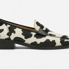 Black and white Zhaylin comfortable loafers by THE WHITMORE FAMILY, featuring a sleek slip-on design and cushioned interior.
