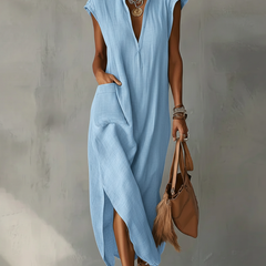 Black Elara Ruffle Spring Maxi Dress by THE WHITMORE FAMILY, flowing fabric with ruffle details and elegant length.