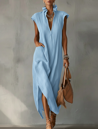 Black Elara Ruffle Spring Maxi Dress by THE WHITMORE FAMILY, flowing fabric with ruffle details and elegant length.