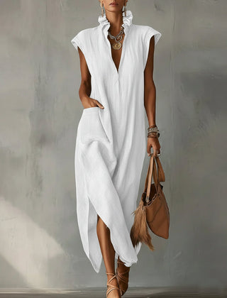 Black Elara Ruffle Spring Maxi Dress by THE WHITMORE FAMILY, flowing fabric with ruffle details, perfect for warm-weather occasions.