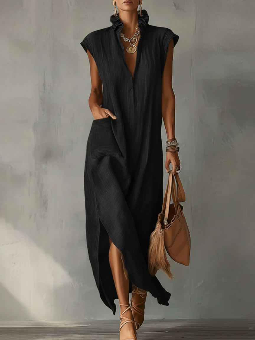 Black Elara ruffle spring maxi dress by THE WHITMORE FAMILY, flowing fabric with ruffle details and a stylish silhouette.