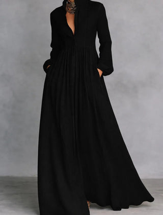 Black Elise flowing button-front maxi dress by THE WHITMORE FAMILY, featuring lightweight fabric and elegant design.