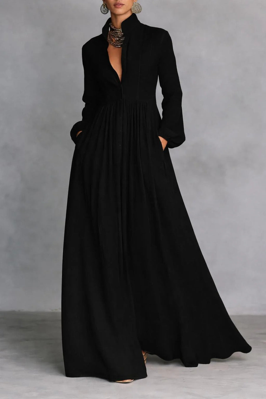 Black Elise flowing button-front maxi dress by THE WHITMORE FAMILY, featuring lightweight fabric and elegant design.