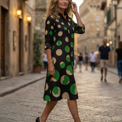Black Kaia Dinner Walk Dress by THE WHITMORE FAMILY, showcasing a stylish, elegant dress with a fitted silhouette and flowing skirt.