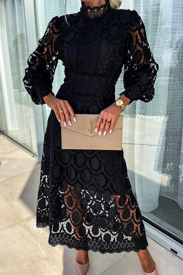 Black Liza romantic lace dress by THE WHITMORE FAMILY, featuring delicate lace details and a flattering silhouette.