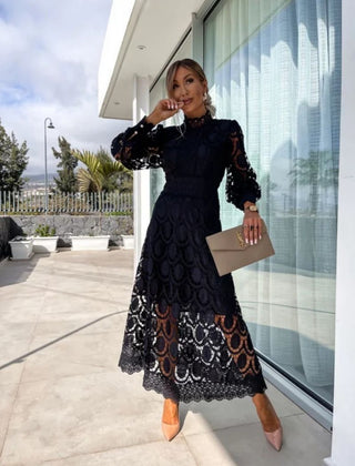 Black Liza romantic lace dress by THE WHITMORE FAMILY, featuring delicate lace fabric and elegant design.