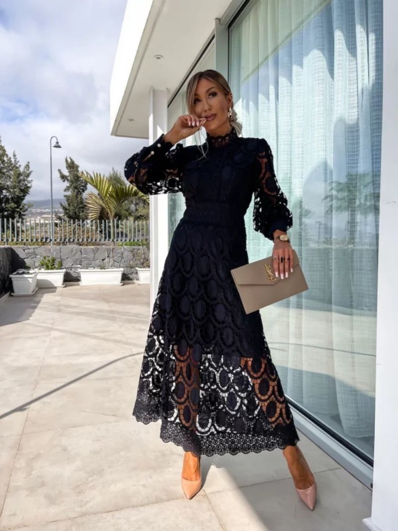 Black Liza romantic lace dress by THE WHITMORE FAMILY, featuring delicate lace fabric and elegant design.