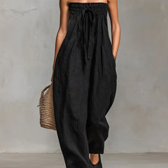Black Nova strapless flow maxi dress by THE WHITMORE FAMILY, flowing fabric and elegant design perfect for formal occasions.