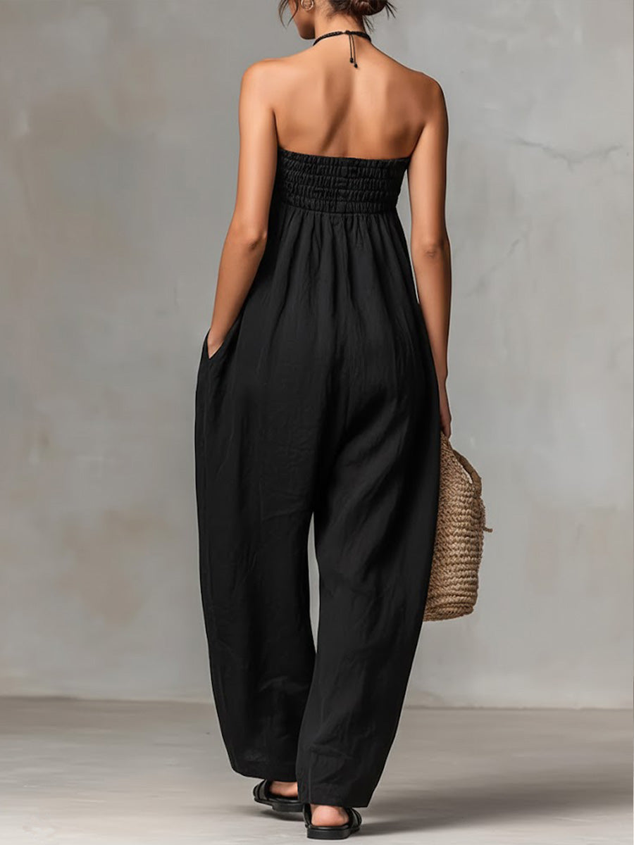 Black Nova strapless flow maxi dress by THE WHITMORE FAMILY, featuring a flowing fabric and elegant strapless design.
