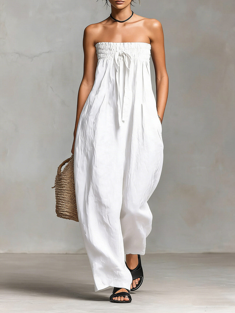 Black Nova strapless flow maxi dress by THE WHITMORE FAMILY, featuring a flowing design and elegant strapless silhouette.