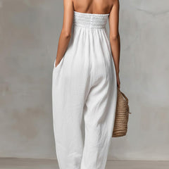 Black Nova strapless flow maxi dress by THE WHITMORE FAMILY, featuring a relaxed, flowing fabric and elegant strapless design.