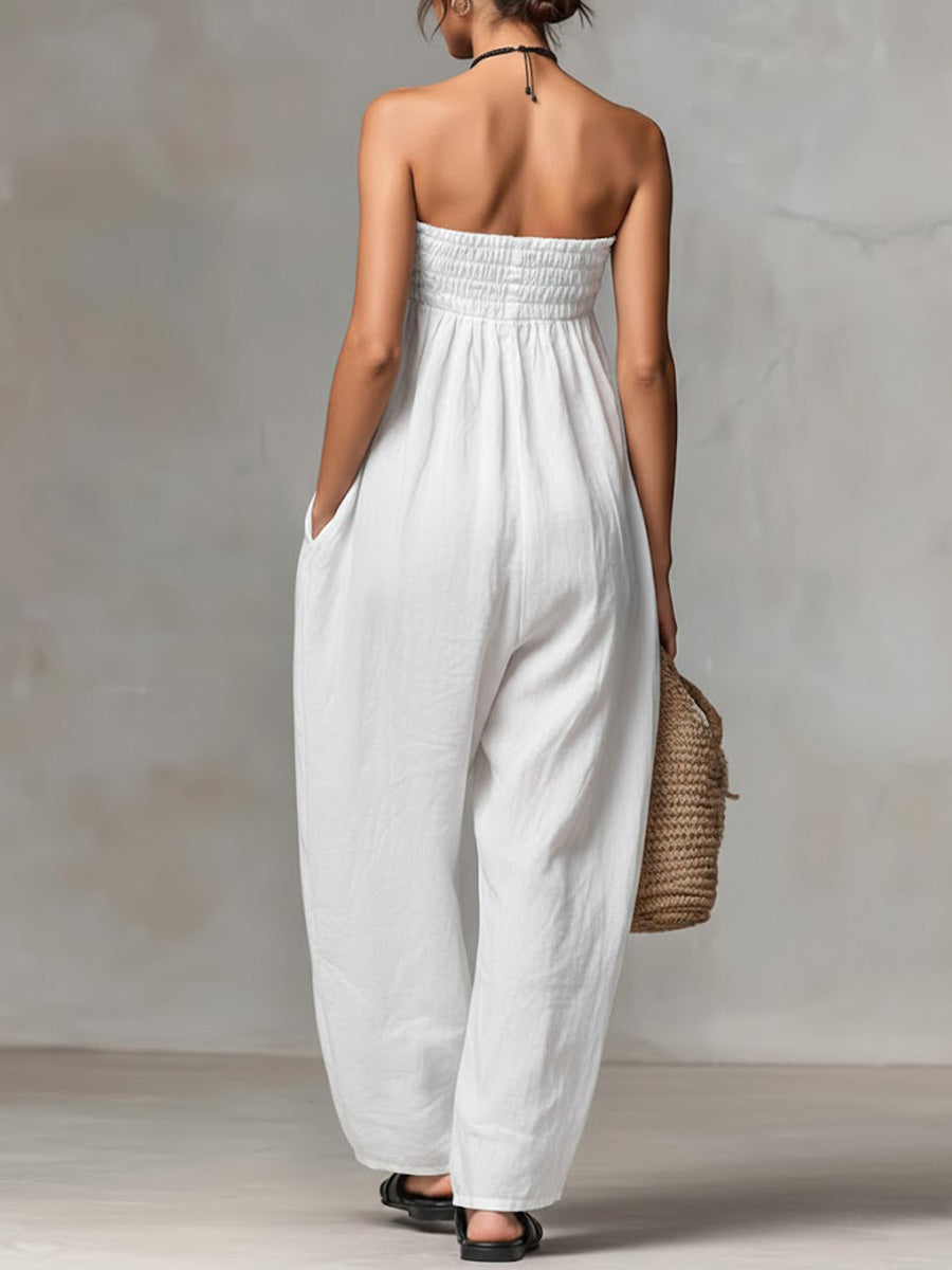 Black Nova strapless flow maxi dress by THE WHITMORE FAMILY, featuring a relaxed, flowing fabric and elegant strapless design.