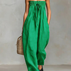 Black Nova strapless flow maxi dress by THE WHITMORE FAMILY, featuring a flowing fabric and elegant strapless design.